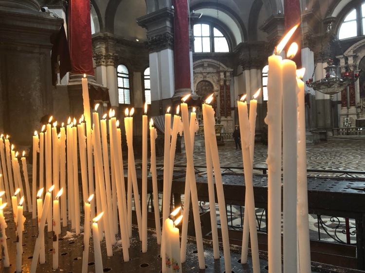 A forest of candles in the church