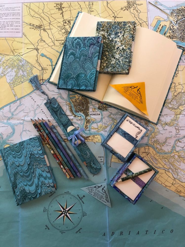 Il Pavone - Venezia sells a superb range of handmade note books, hand coloured papers, pencils and wonderful waste-paper baskets for the office.
